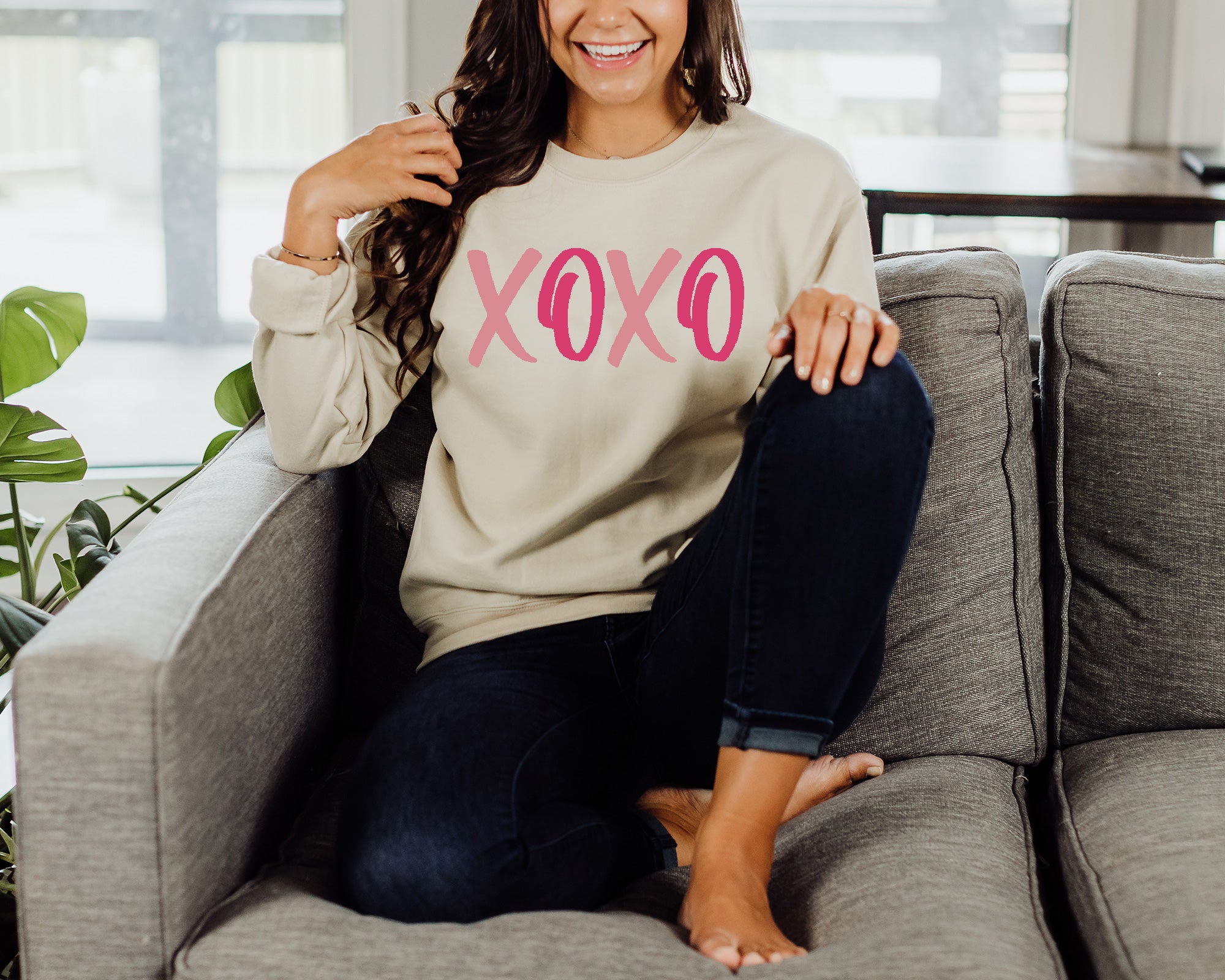 girl wearing tan sweatshirt