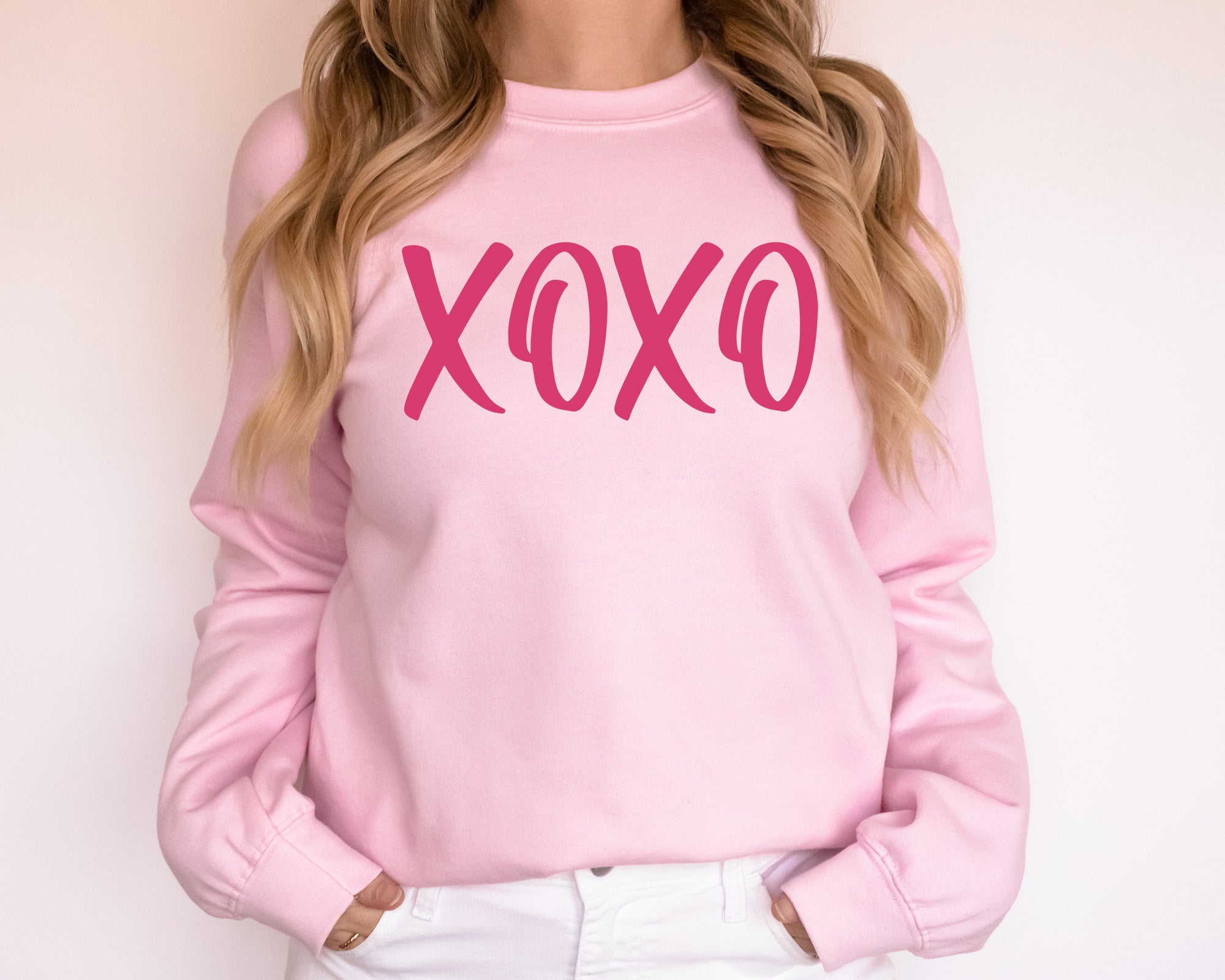 girl wearing pink sweatshirt